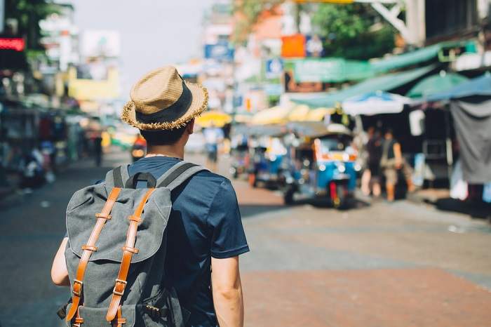 backpack and straw hat